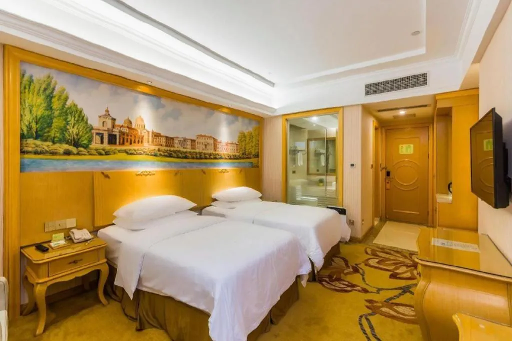 Bed in Vienna Hotel Guangdong Meizhou Fengshun