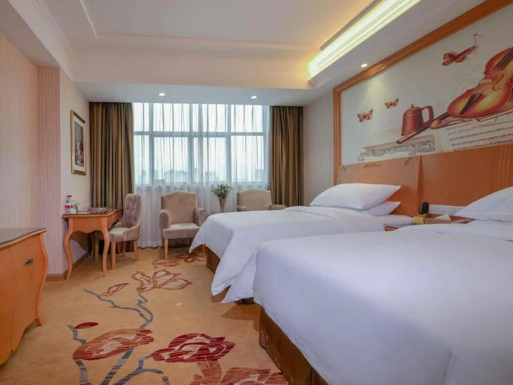 Bed in Vienna Hotel Guangdong Huiyang Qiuchang Yingbin Road