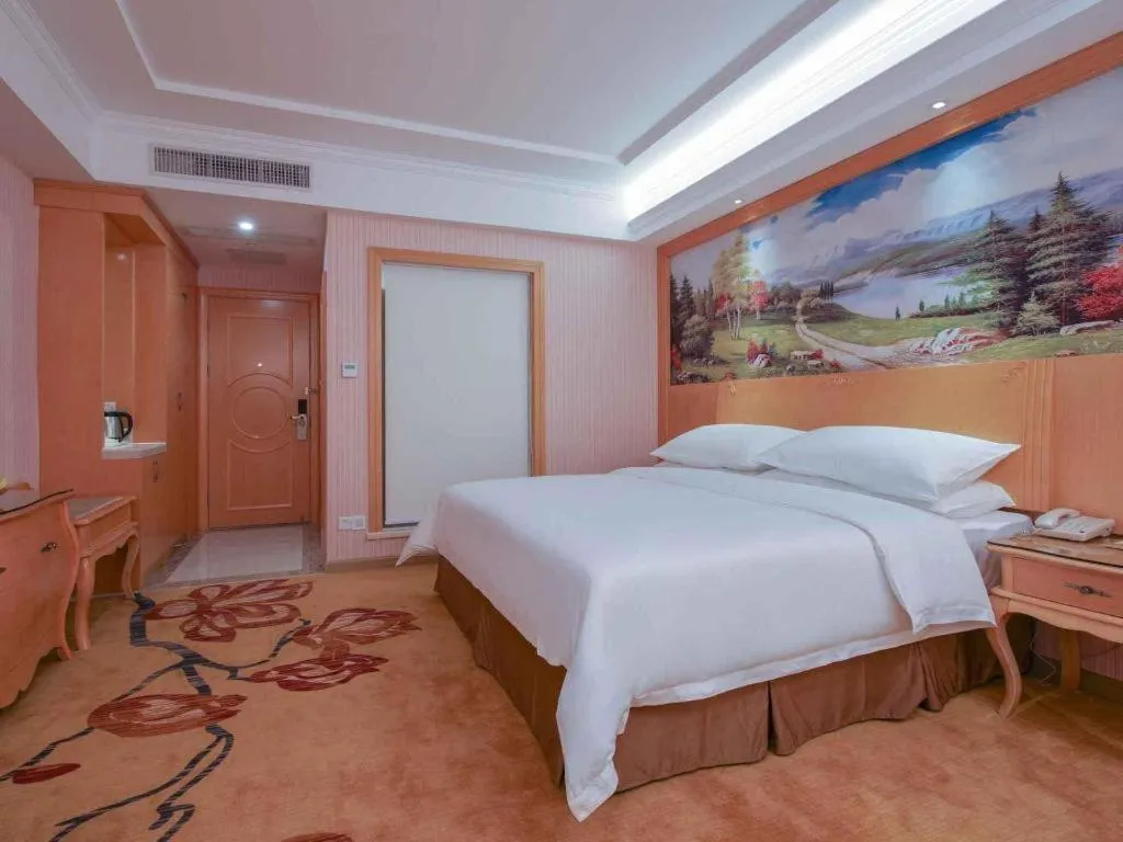 Bed in Vienna Hotel Guangdong Huiyang Qiuchang Yingbin Road