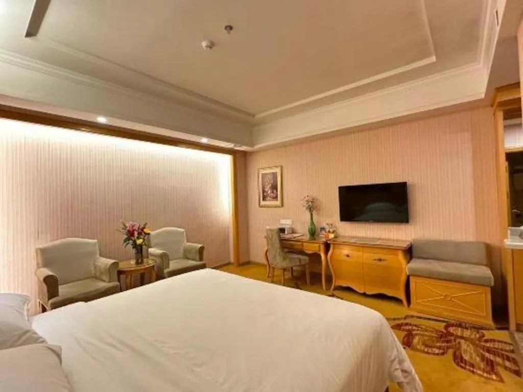 Bed in Vienna Hotel Guangdong Huiyang Qiuchang Yingbin Road