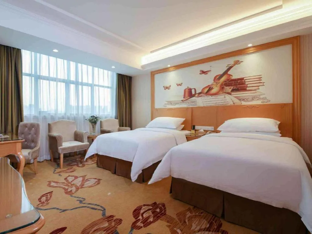 Bed in Vienna Hotel Guangdong Huiyang Qiuchang Yingbin Road