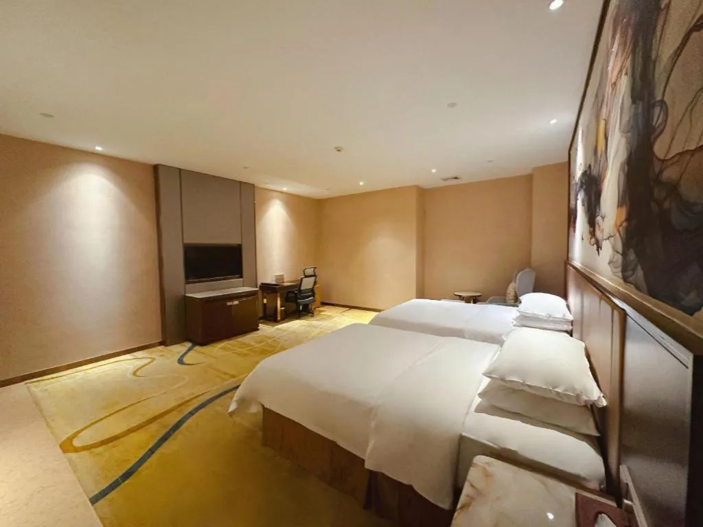 Bed in Venus Royal Hotel Nanning East High-Speed Railway Station