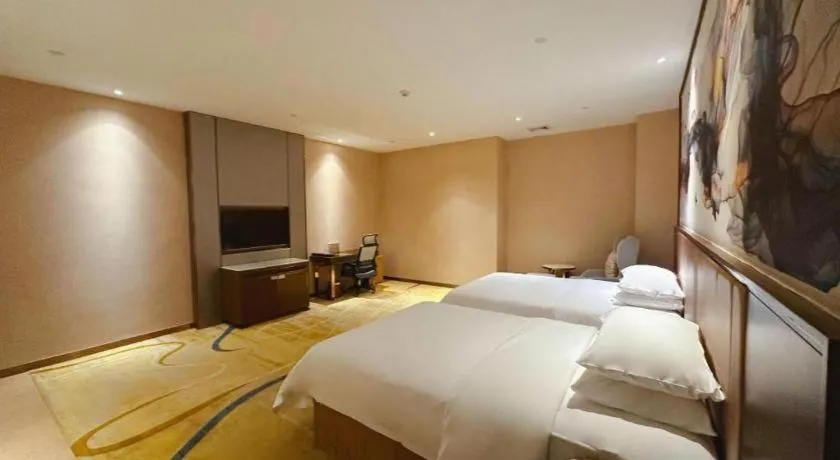 Bed in Venus Royal Hotel Nanning East High-Speed Railway Station