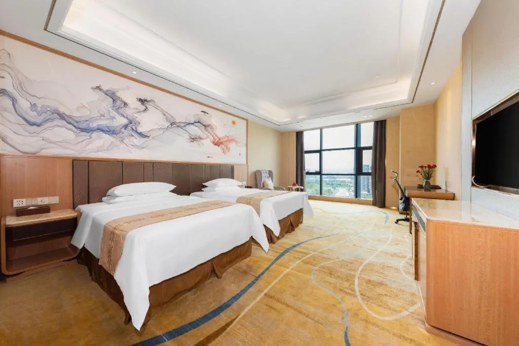 Bed in Venus Royal Hotel Nanning East High-Speed Railway Station