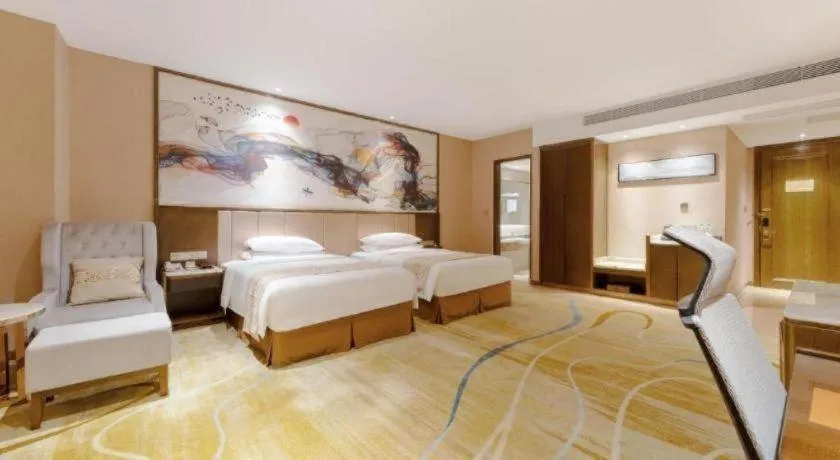 Bed in Venus Royal Hotel Nanning East High-Speed Railway Station