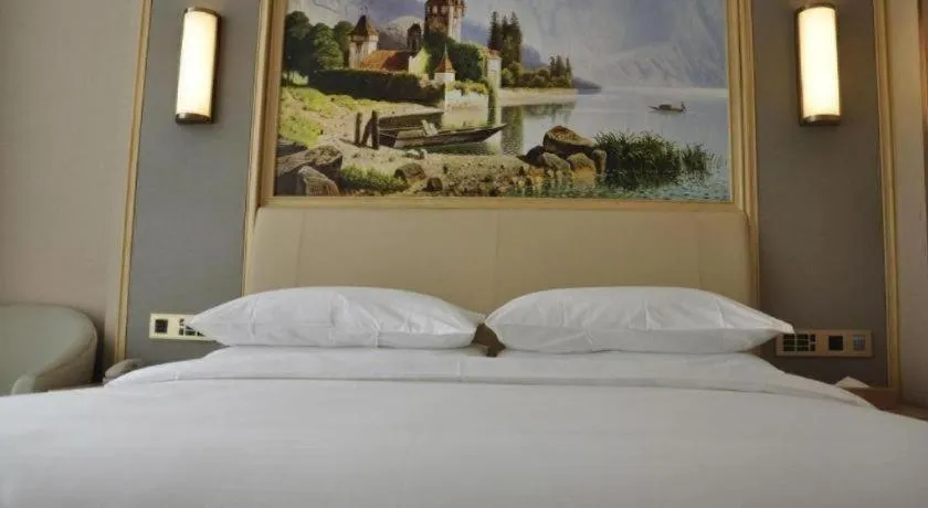 Bed in Vienna Hotel Guangdong Zhaoqing East Station Dinghu Mountain Scenic Area