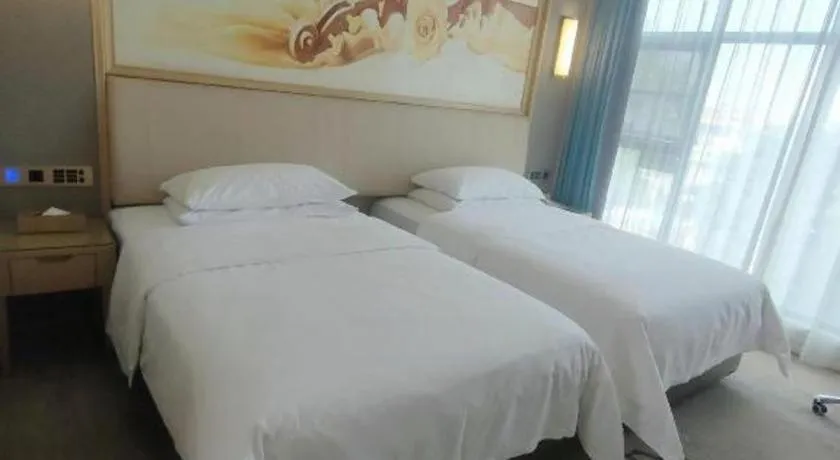 Bed in Vienna Hotel Guangdong Zhaoqing East Station Dinghu Mountain Scenic Area