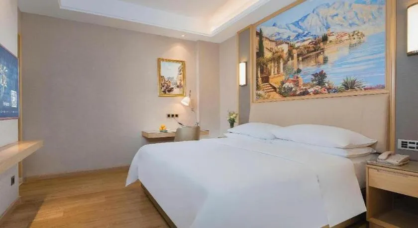 Bed in Vienna Hotel Guangdong Zhaoqing East Station Dinghu Mountain Scenic Area