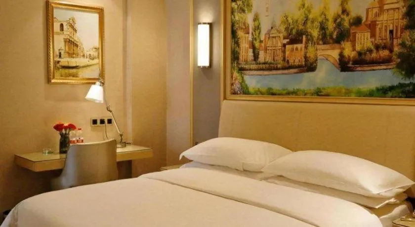 Bed in Vienna Hotel Guangdong Zhaoqing East Station Dinghu Mountain Scenic Area