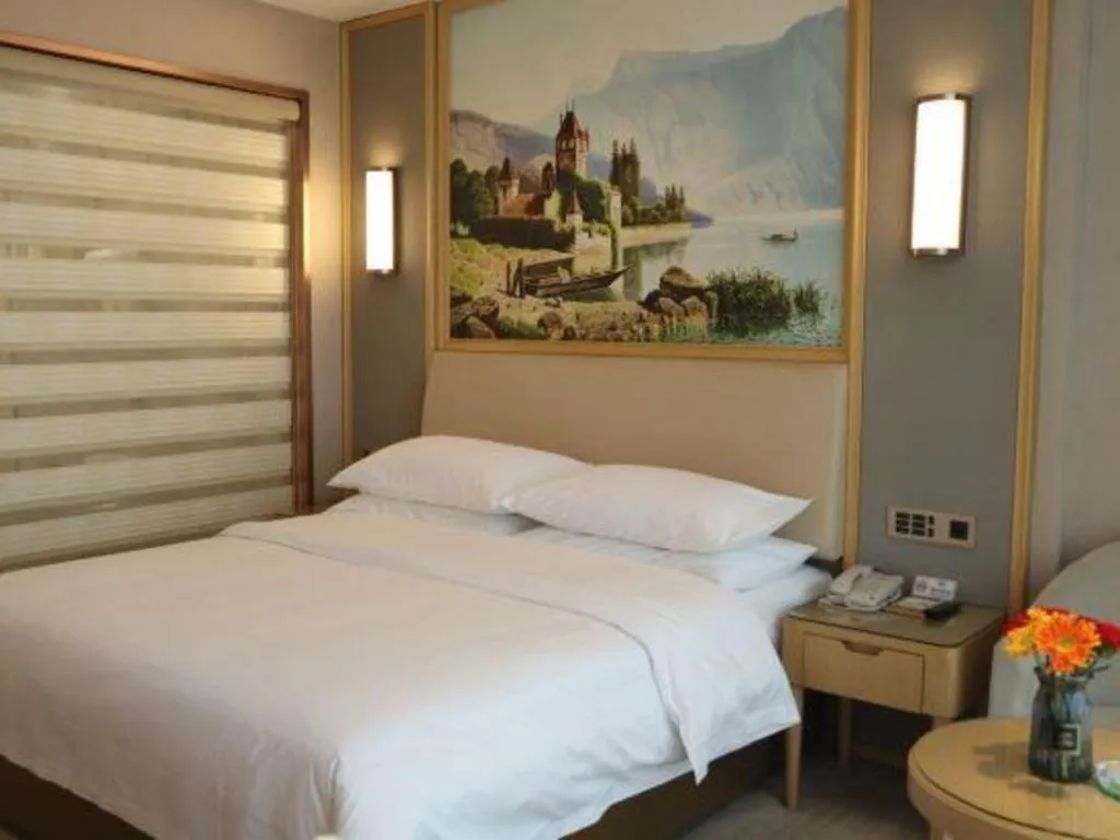 Bed in Vienna Hotel Guangdong Zhaoqing East Station Dinghu Mountain Scenic Area