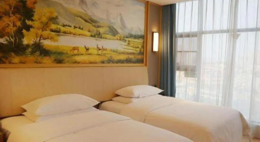 Bed in Vienna Hotel Guangdong Zhaoqing East Station Dinghu Mountain Scenic Area