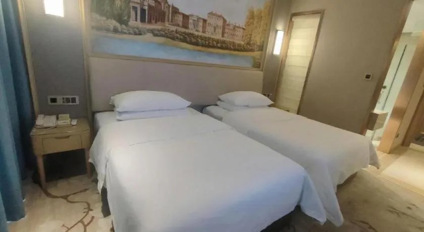 Bed in Vienna Hotel Guangdong Zhaoqing East Station Dinghu Mountain Scenic Area