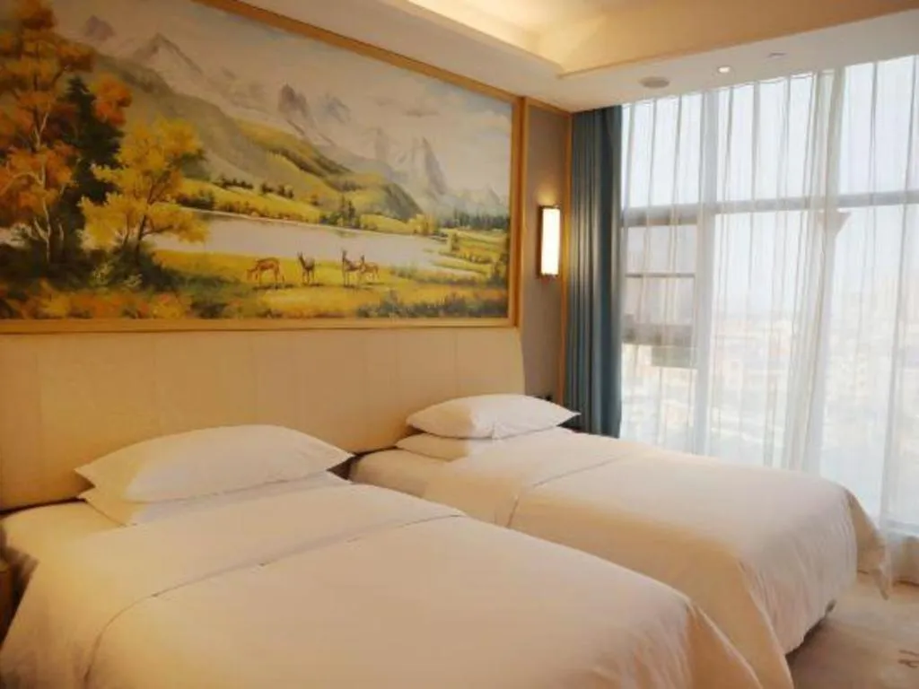 Bed in Vienna Hotel Guangdong Zhaoqing East Station Dinghu Mountain Scenic Area