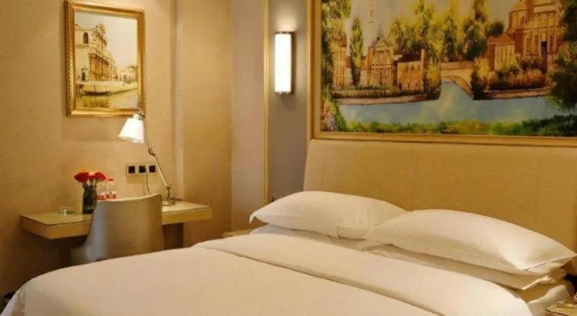 Bed in Vienna Hotel Guangdong Zhaoqing East Station Dinghu Mountain Scenic Area