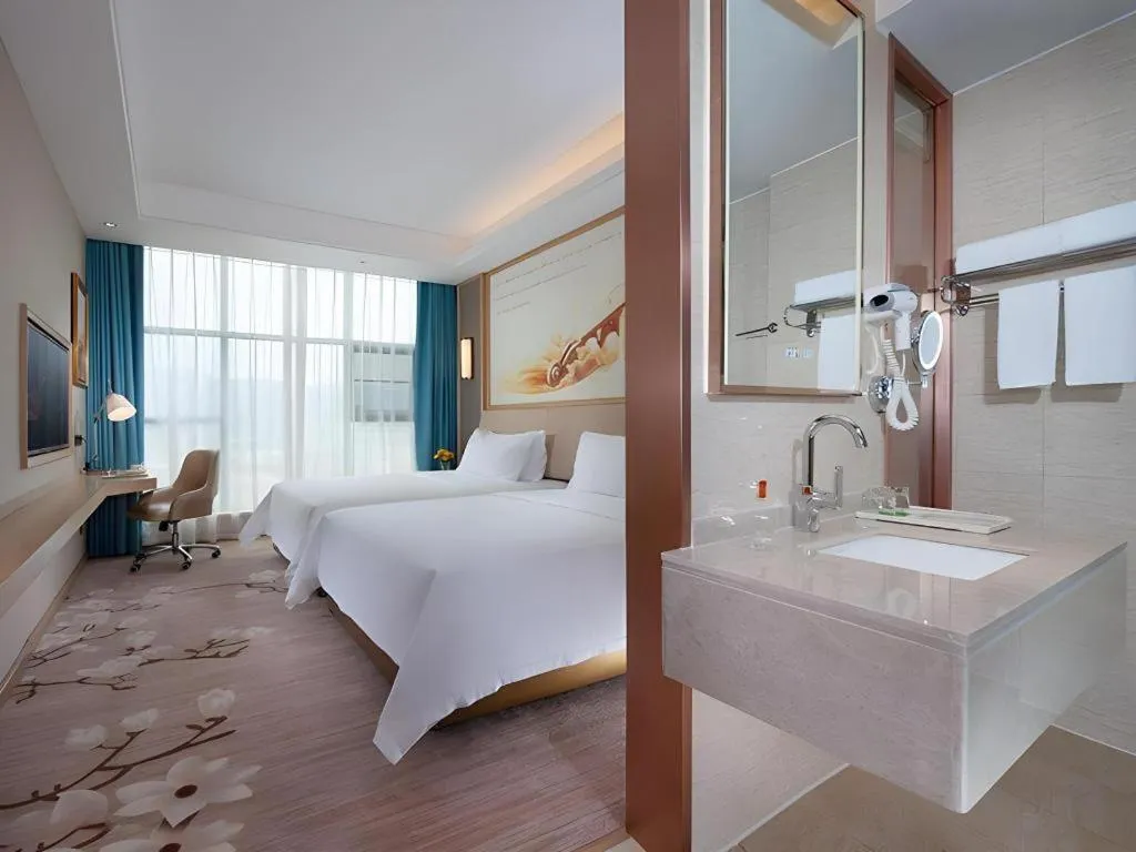 Bed in Vienna Hotel Guangdong Zhaoqing East Station Dinghu Mountain Scenic Area