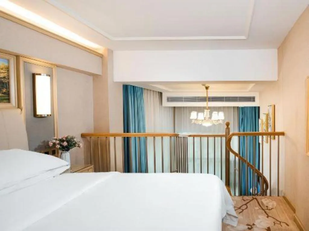 Bed in Vienna Hotel Guangdong Zhaoqing East Station Dinghu Mountain Scenic Area