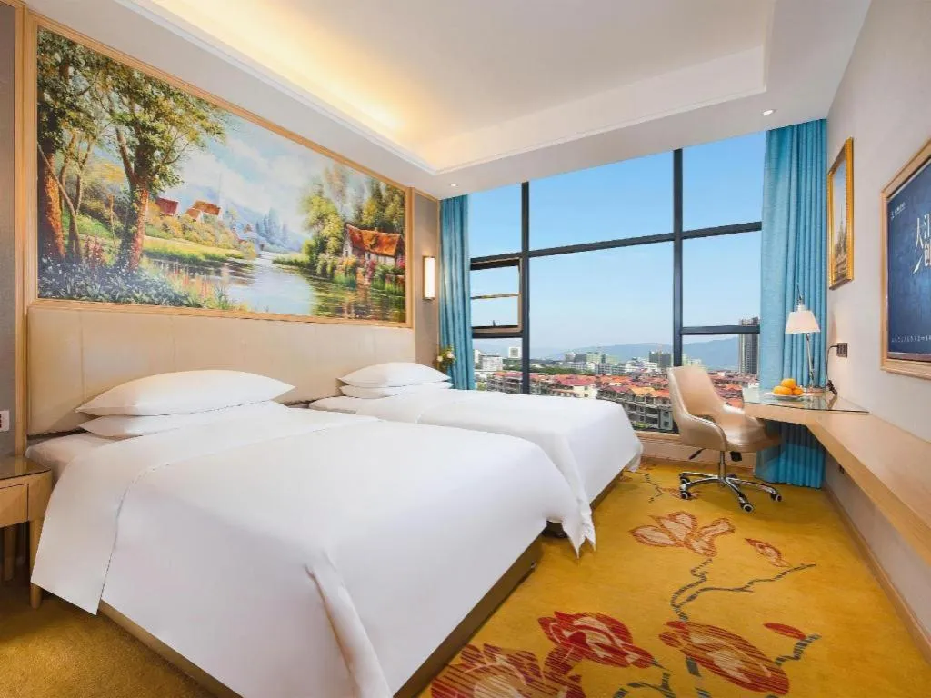 Bed in Vienna Hotel Guangdong Zhaoqing East Station Dinghu Mountain Scenic Area