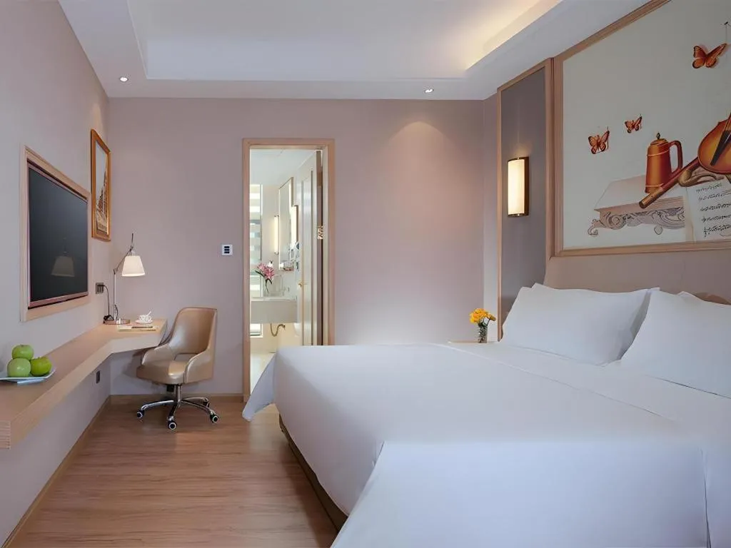 Bed in Vienna Hotel Guangdong Zhaoqing East Station Dinghu Mountain Scenic Area