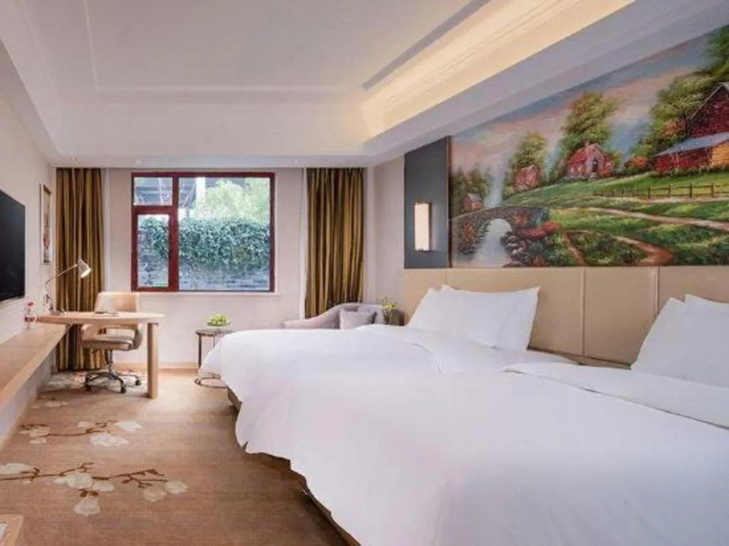 Bed in Vienna Hotel Yunnan Lijiang Ancient City