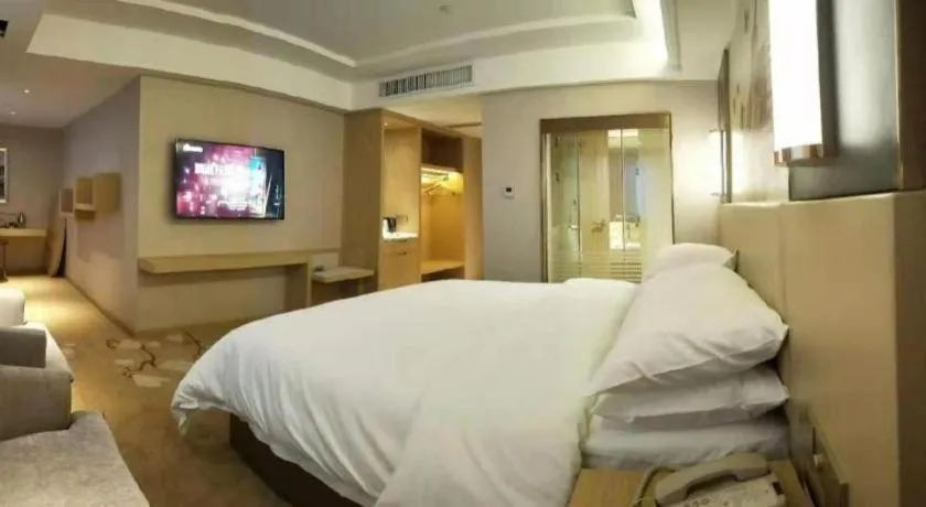 Bed in Vienna Hotel Yunnan Lijiang Ancient City