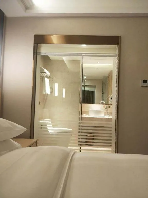 Bed in Vienna Hotel Yunnan Lijiang Ancient City