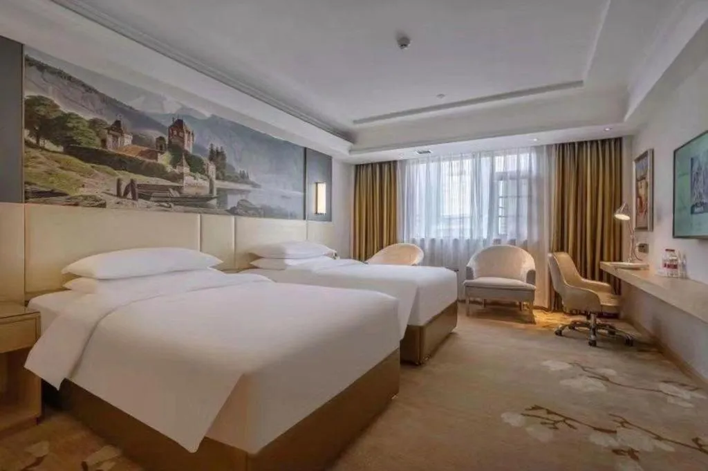 Bed in Vienna Hotel Yunnan Lijiang Ancient City