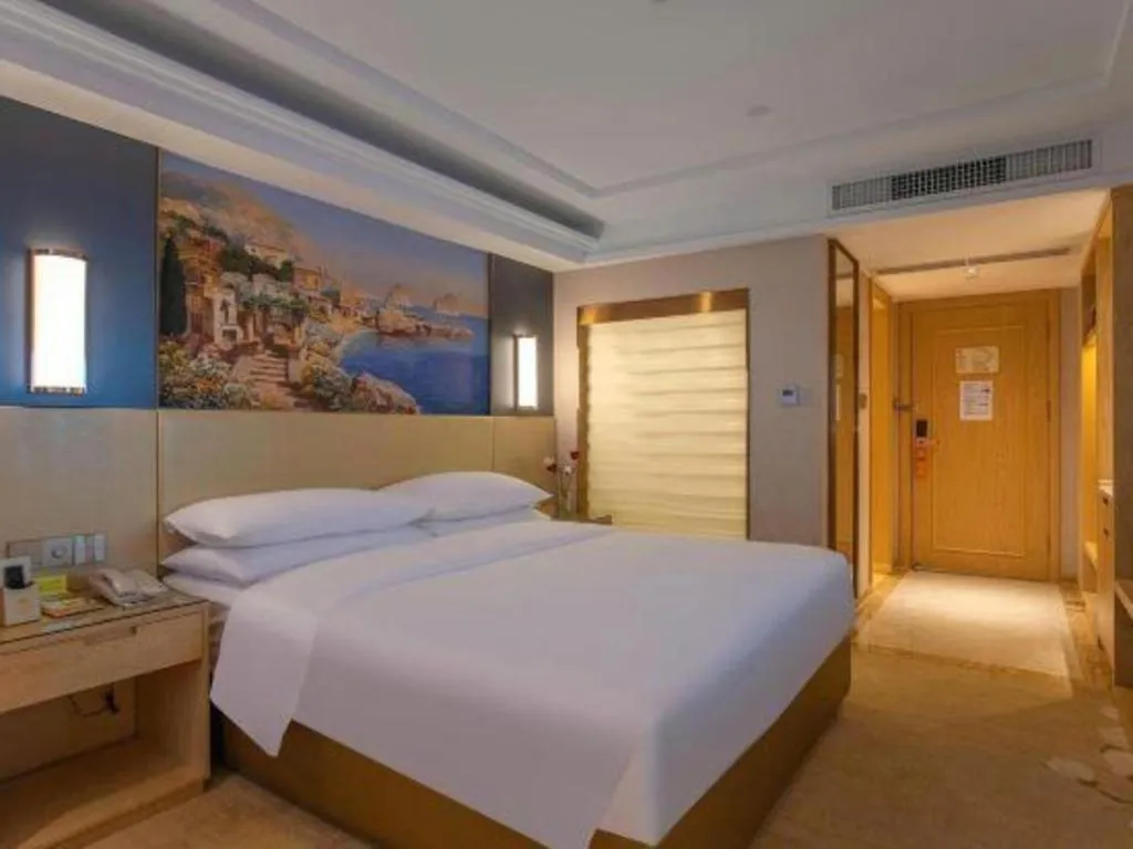 Bed in Vienna Hotel Yunnan Lijiang Ancient City