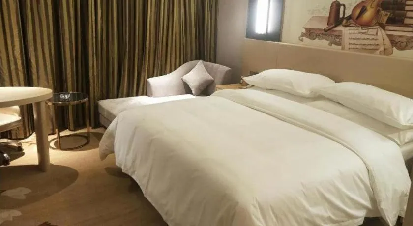 Bed in Vienna Hotel Yunnan Lijiang Ancient City