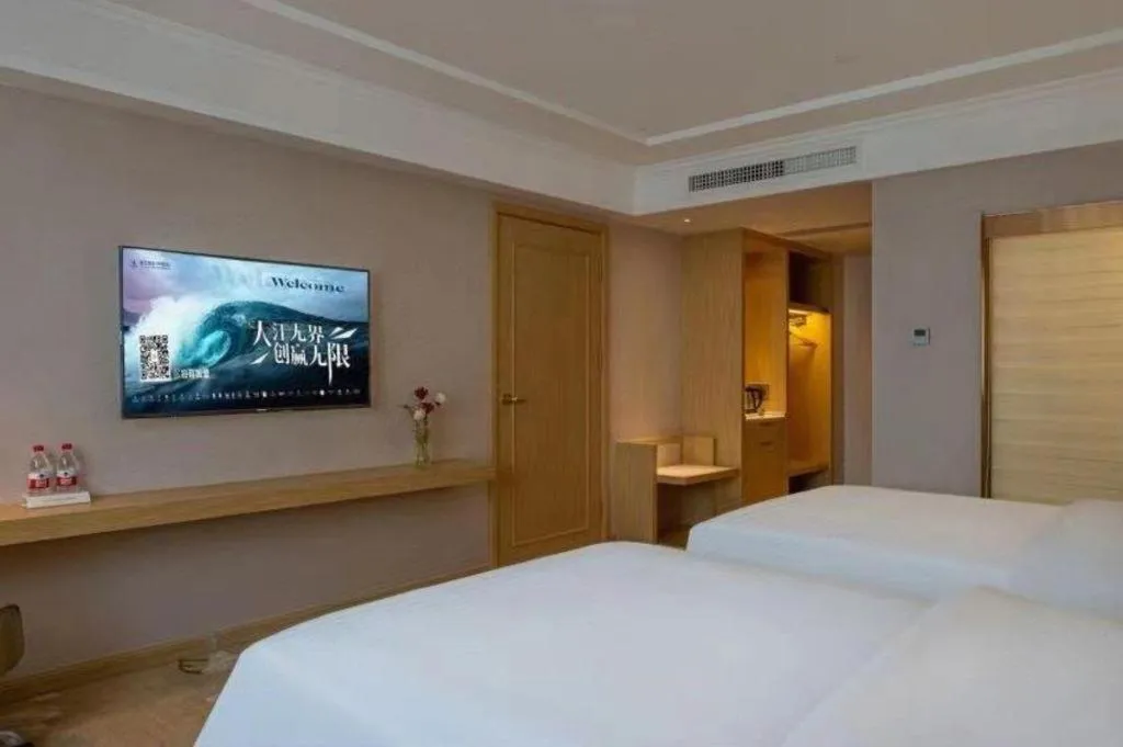 Bed in Vienna Hotel Yunnan Lijiang Ancient City