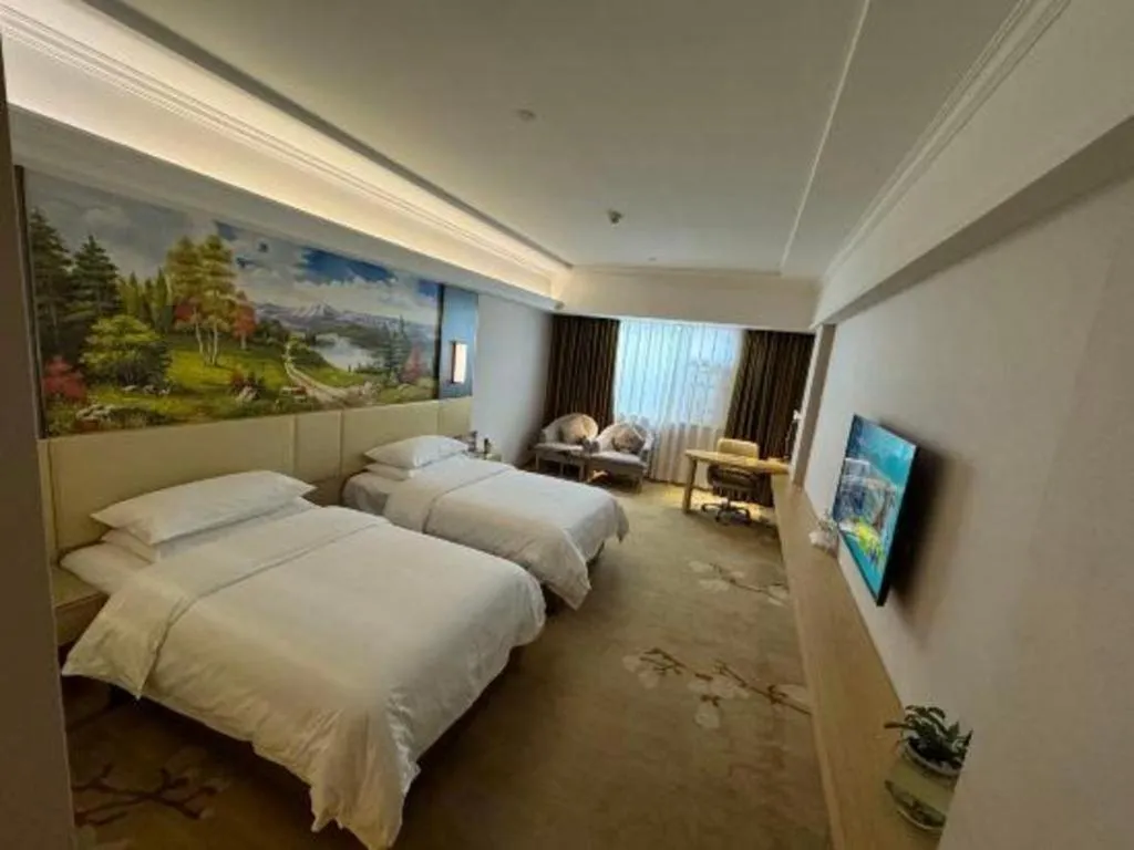 Bed in Vienna Hotel Yunnan Lijiang Ancient City