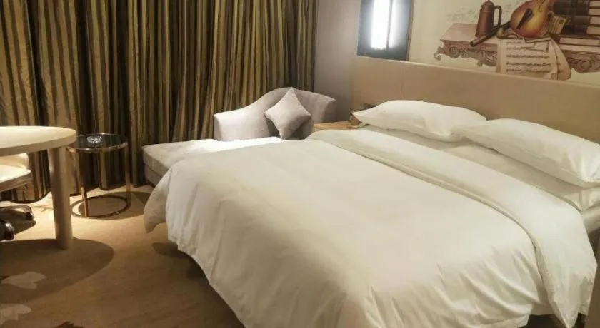 Bed in Vienna Hotel Yunnan Lijiang Ancient City