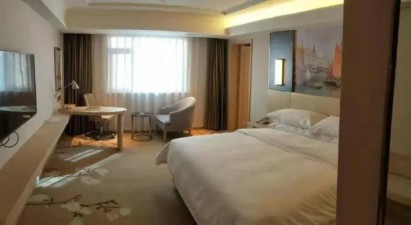 Bed in Vienna Hotel Yunnan Lijiang Ancient City Bed in Vienna Hotel Yunnan Lijiang Ancient City