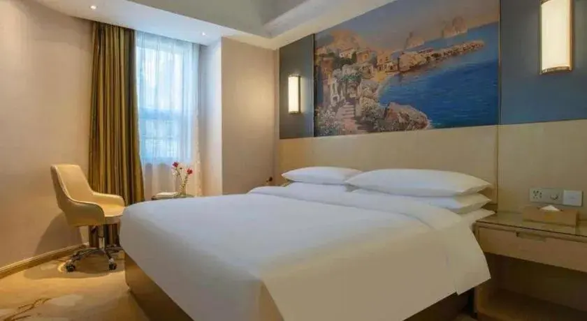 Bed in Vienna Hotel Yunnan Lijiang Ancient City Bed in Vienna Hotel Yunnan Lijiang Ancient City