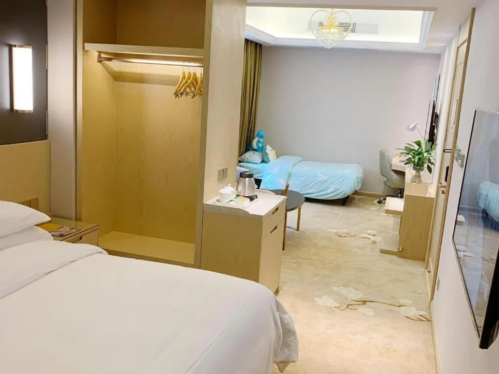 Bed in Vienna Hotel Yunnan Lijiang Ancient City