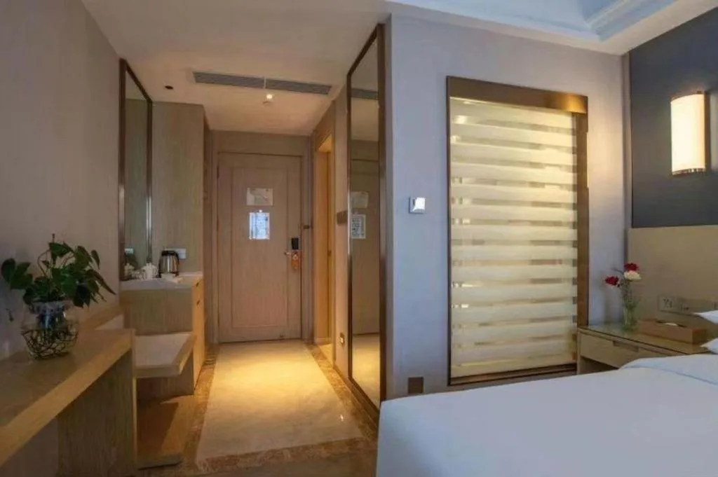 Bed in Vienna Hotel Yunnan Lijiang Ancient City