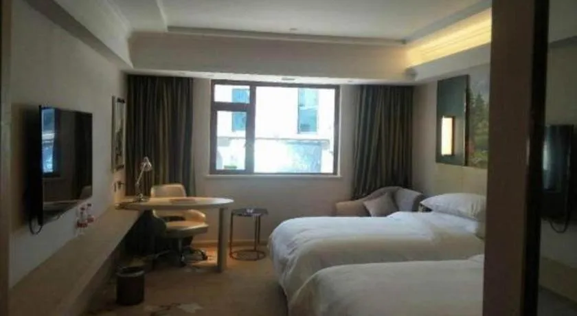 Bed in Vienna Hotel Yunnan Lijiang Ancient City