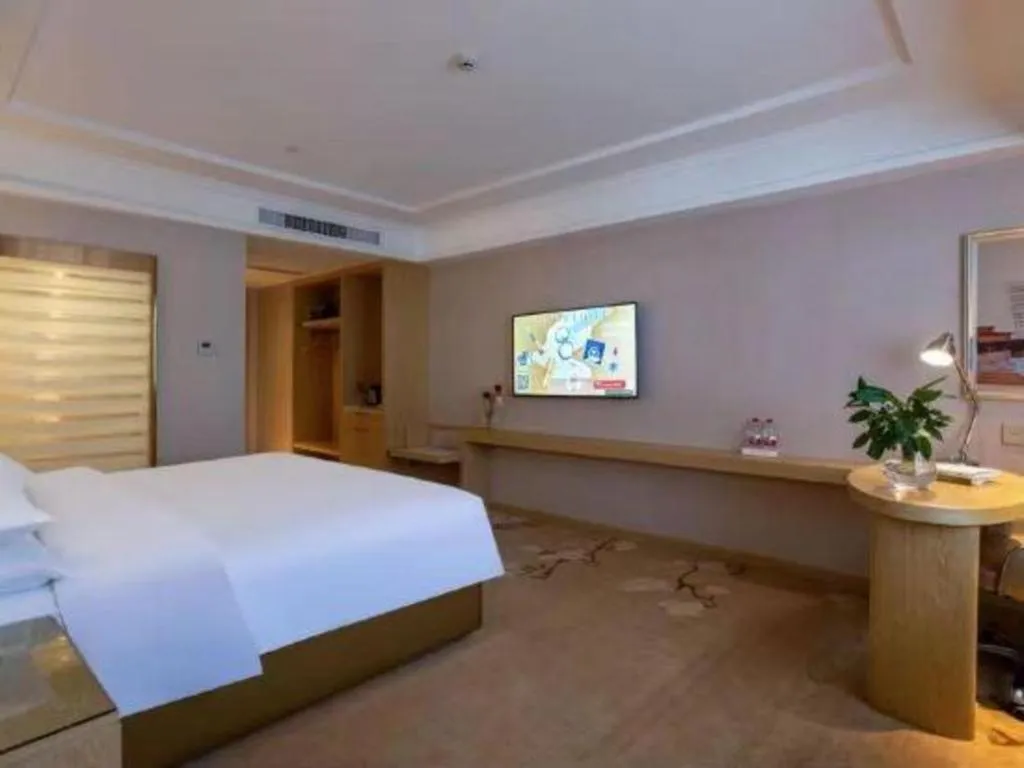 Bed in Vienna Hotel Yunnan Lijiang Ancient City