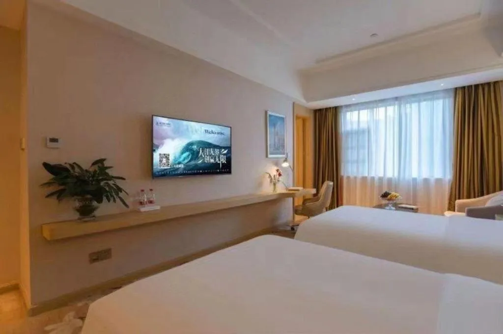 Bed in Vienna Hotel Yunnan Lijiang Ancient City