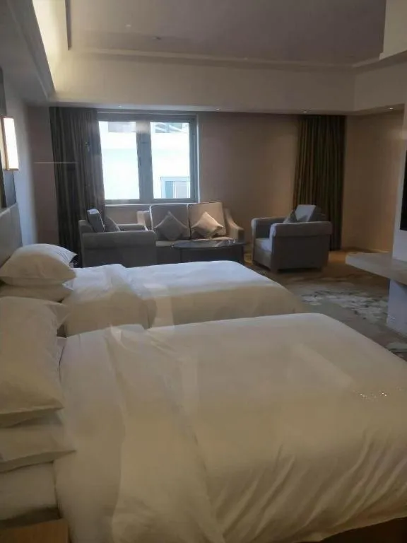 Bed in Vienna Hotel Yunnan Lijiang Ancient City