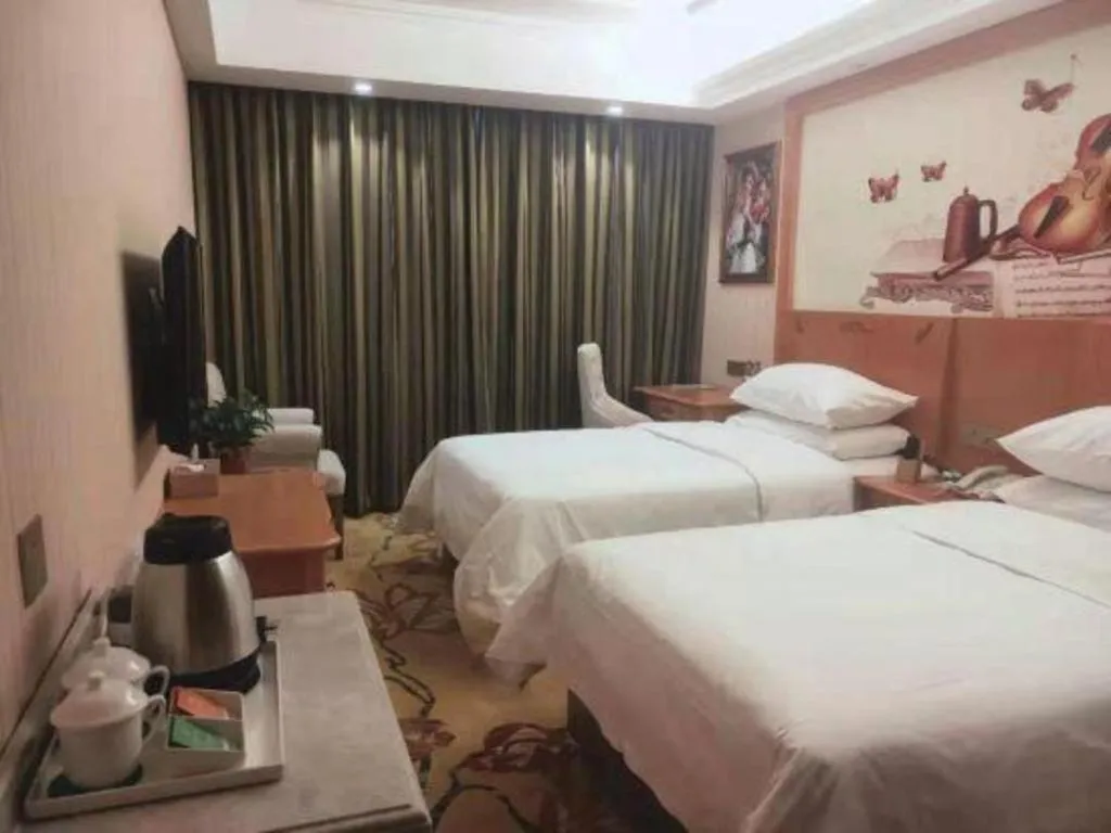 Bed in Vienna Hotel Hebei Cangzhou Mingzhu Market