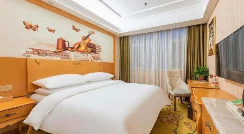 Bed in Vienna Hotel Hebei Cangzhou Mingzhu Market