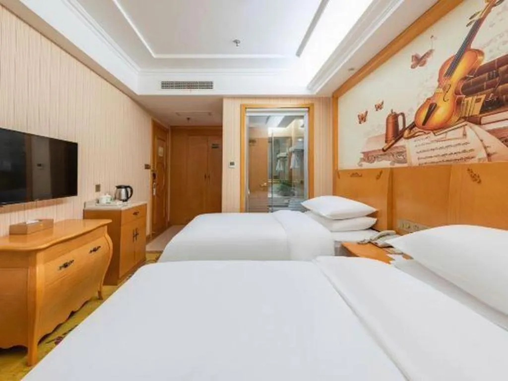 Bed in Vienna Hotel Hebei Cangzhou Mingzhu Market