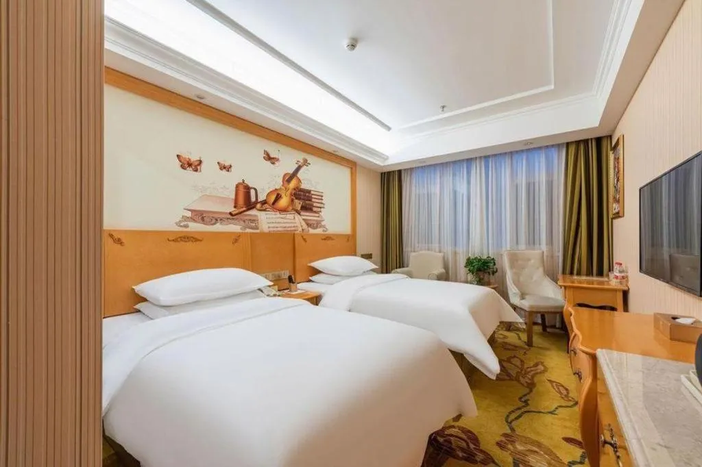 Bed in Vienna Hotel Hebei Cangzhou Mingzhu Market