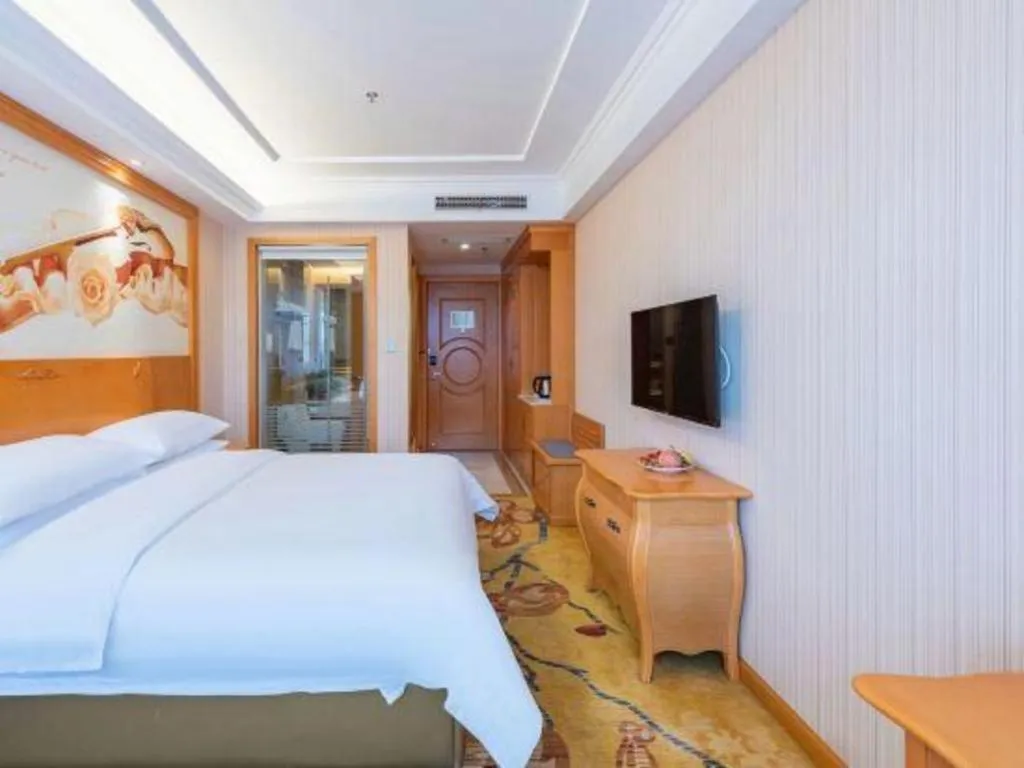 Bed in Vienna Hotel Hebei Cangzhou Mingzhu Market