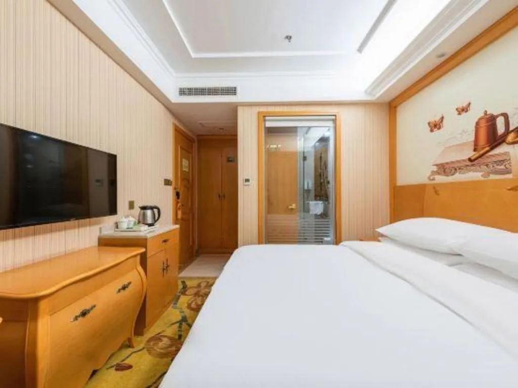 Bed in Vienna Hotel Hebei Cangzhou Mingzhu Market