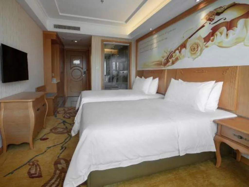 Bed in Vienna Hotel Hebei Cangzhou Mingzhu Market