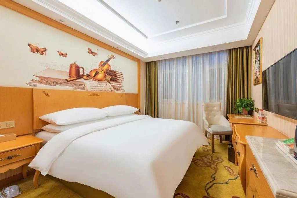 Bed in Vienna Hotel Hebei Cangzhou Mingzhu Market