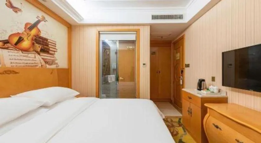 Bed in Vienna Hotel Hebei Cangzhou Mingzhu Market