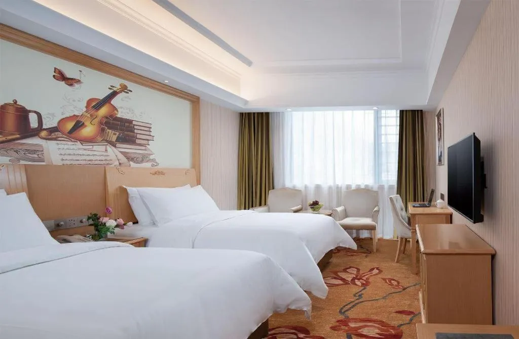 Bed in Vienna Hotel Hunan Jishou Fenghuang Ancient City