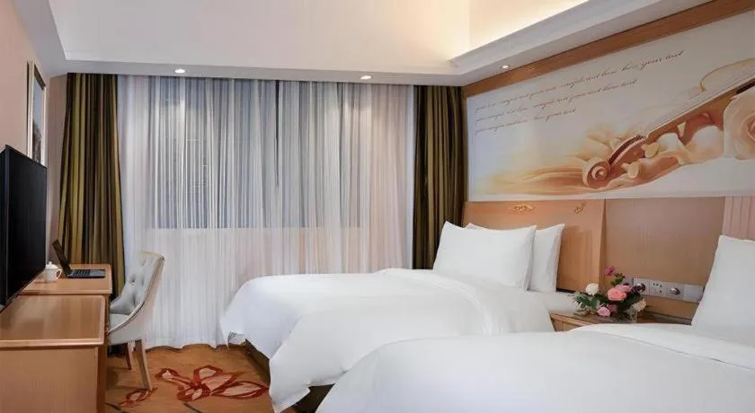 Bed in Vienna Hotel Hunan Jishou Fenghuang Ancient City